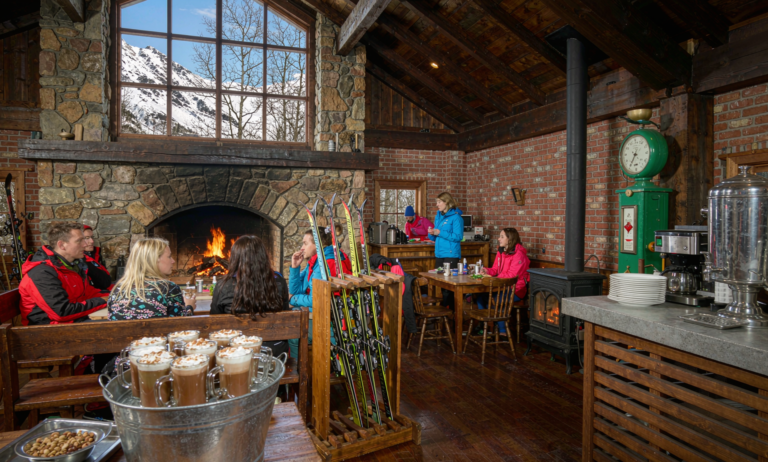 Cozy apres-ski lounge with fireplace at a Xinjiang lodge