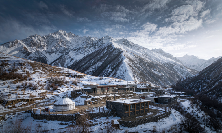 A remote Pamir foothill village with a Kyrgyz yurt under snow in western Xinjiang
