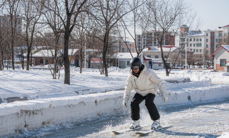 Spring skiing on slushy snow under sunshine in Xinjiang
